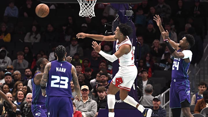 Nov 28, 2025; Charlotte, North Carolina, USA; Chicago Bulls guard Tre Jones (30) passes during the first half against the Charlotte Hornets at the Spectrum Center. Mandatory Credit: Sam Sharpe-Imagn Images Nov 28, 2025; Charlotte, North Carolina, USA; Chicago Bulls guard Tre Jones (30) passes during the first half against the Charlotte Hornets at the Spectrum Center. Mandatory Credit: Sam Sharpe-Imagn Images