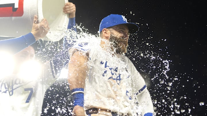 May 28, 2025; Kansas City, Missouri, USA; Kansas City Royals right fielder John Rave (26) is doused by shortstop Bobby Witt Jr. (7) and second baseman Jonathan India (6) after defeating the Cincinnati Reds at Kauffman Stadium. Mandatory Credit: Jay Biggerstaff-Imagn Images May 28, 2025; Kansas City, Missouri, USA; Kansas City Royals right fielder John Rave (26) is doused by shortstop Bobby Witt Jr. (7) and second baseman Jonathan India (6) after defeating the Cincinnati Reds at Kauffman Stadium. Mandatory Credit: Jay Biggerstaff-Imagn Images