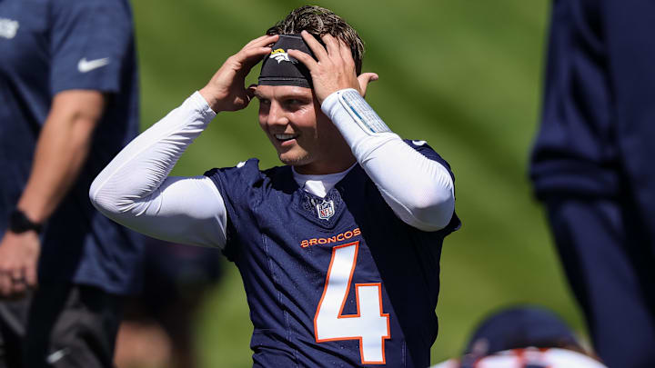 Denver Broncos quarterback Zach Wilson (4) during organized team activities at Centura Health Training Center. Denver Broncos quarterback Zach Wilson (4) during organized team activities at Centura Health Training Center.