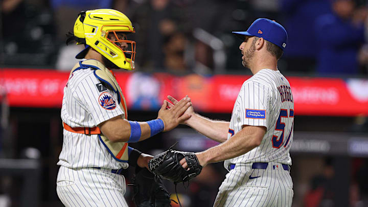 Apr 29, 2025; New York City, New York, USA; New York Mets relief pitcher Kevin Herget (57) celebrates with New York Mets catcher Francisco Alvarez (4) after defeating the Arizona Diamondbacks at Citi Field. Mandatory Credit: Vincent Carchietta-Imagn Images