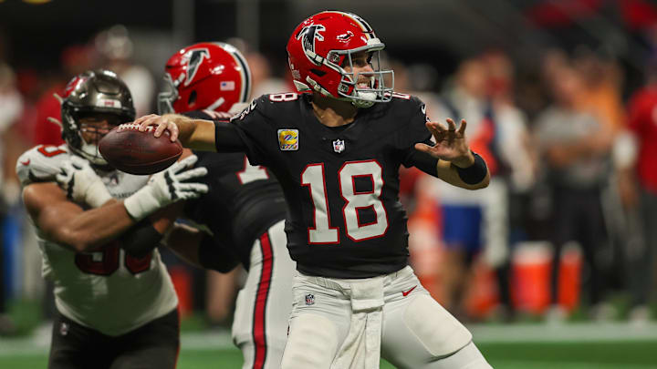 Oct 3, 2024; Atlanta, Georgia, USA; Atlanta Falcons quarterback Kirk Cousins (18) throws against the Tampa Bay Buccaneers in the second quarter at Mercedes-Benz Stadium. Mandatory Credit: Brett Davis-Imagn Images
