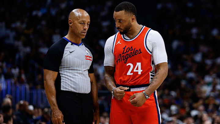 Apr 21, 2025; Denver, Colorado, USA; Los Angeles Clippers guard Norman Powell (24) talks with referee Marc Davis (8) in the third quarter against the Denver Nuggets during game two of first round for the 2025 NBA Playoffs at Ball Arena. Mandatory Credit: Isaiah J. Downing-Imagn Images