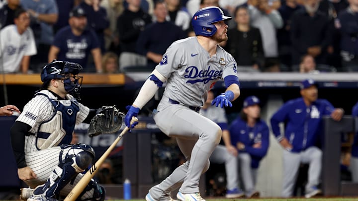 Oct 30, 2024; New York, New York, USA; Los Angeles Dodgers second baseman Gavin Lux (9) hits a RBI sacrifice fly during the eighth inning against the New York Yankees in game five of the 2024 MLB World Series at Yankee Stadium. Mandatory Credit: Vincent Carchietta-Imagn Images