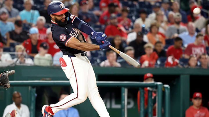 Jul 21, 2025; Washington, District of Columbia, USA; Washington Nationals third baseman Amed Rosario (13) hits an RBI double during the sixth inning against the Cincinnati Reds at Nationals Park. Jul 21, 2025; Washington, District of Columbia, USA; Washington Nationals third baseman Amed Rosario (13) hits an RBI double during the sixth inning against the Cincinnati Reds at Nationals Park.