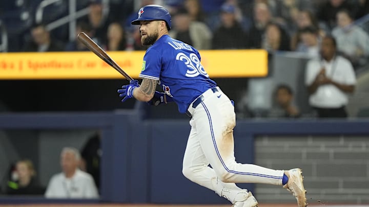 May 22, 2025; Toronto, Ontario, CAN; Toronto Blue Jays right fielder Nathan Lukes (38) hits a  walk off single during the eleventh inning against the San Diego Padres at Rogers Centre.