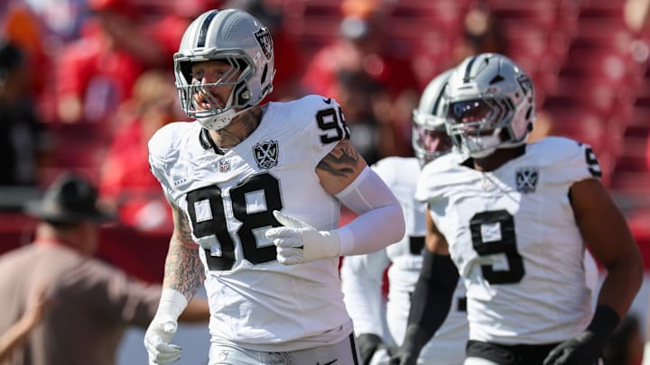 Dec 8, 2024; Tampa, Florida, USA; Las Vegas Raiders defensive end Maxx Crosby (98) takes the field for a game against the Tampa Bay Buccaneers at Raymond James Stadium. Mandatory Credit: Nathan Ray Seebeck-Imagn Images
