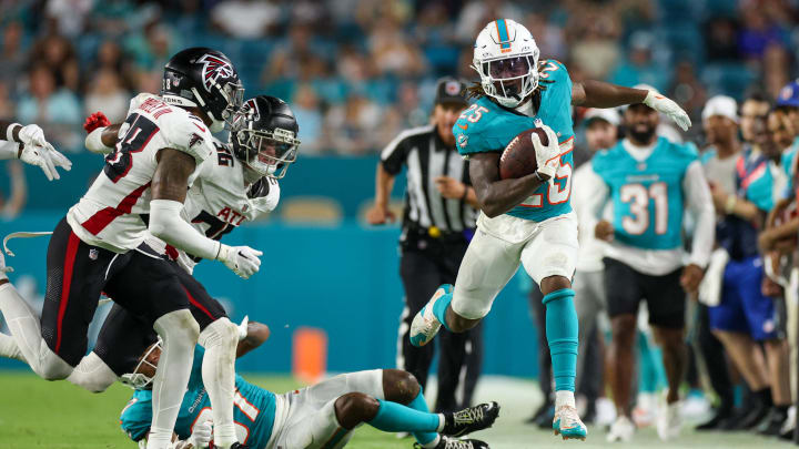 Aug 9, 2024; Miami Gardens, Florida, USA; Miami Dolphins running back Jaylen Wright (25) runs down the sideline against the Atlanta Falcons in the third quarter during preseason at Hard Rock Stadium.