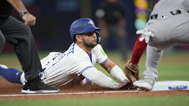 Apr 29, 2025; Toronto, Ontario, CAN; Toronto Blue Jays shortstop Bo Bichette (11) gets caught trying to steal third base against Boston Red Sox third baseman Alex Bregman (2) during the first inning at Rogers Centre. Mandatory Credit: John E. Sokolowski-Imagn Images Apr 29, 2025; Toronto, Ontario, CAN; Toronto Blue Jays shortstop Bo Bichette (11) gets caught trying to steal third base against Boston Red Sox third baseman Alex Bregman (2) during the first inning at Rogers Centre. Mandatory Credit: John E. Sokolowski-Imagn Images