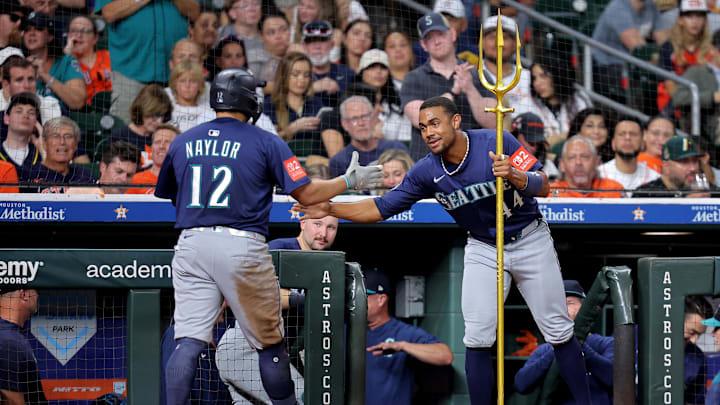 Sep 19, 2025; Houston, Texas, USA; Seattle Mariners first baseman Josh Naylor (12) is congratulated by Seattle Mariners center fielder Julio Rodriguez (44) after hitting a home run to right-center field against the Houston Astros during the eighth inning at Daikin Park. Mandatory Credit: Erik Williams-Imagn Images