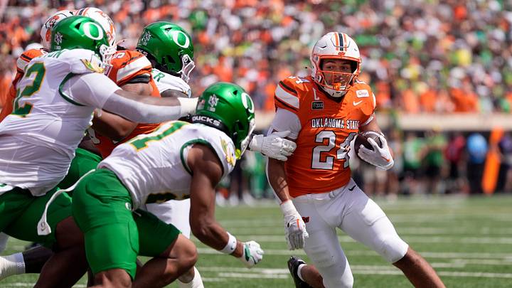 Oklahoma State's Caleb Hawkins (24) rushed in the first half of the college football game between the Oklahoma State Cowboys and the Oregon Ducks at Boone Pickens Stadium in Stillwater, Okla., Saturday, Sept., 12, 2026. Oklahoma State's Caleb Hawkins (24) rushed in the first half of the college football game between the Oklahoma State Cowboys and the Oregon Ducks at Boone Pickens Stadium in Stillwater, Okla., Saturday, Sept., 12, 2026.