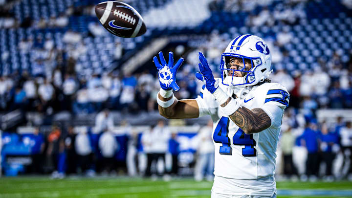 BYU DE Ephraim Asiata warms up for game against Kansas State 