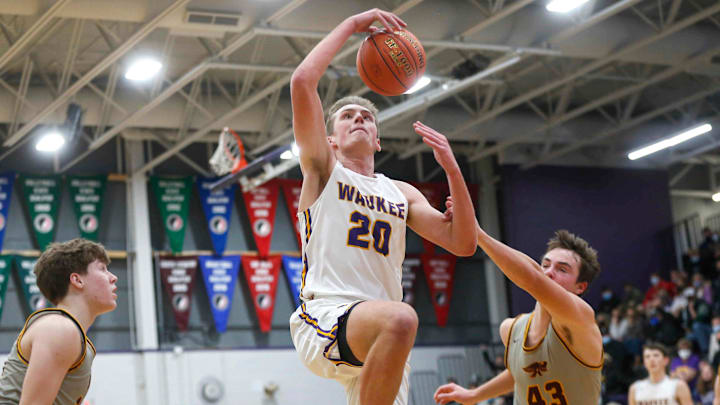 Waukee senior forward Payton Sandfort is fouled by Ankeny sophomore Karson Wehde in the fourth quarter during the Class 4A regional final on Tuesday, March 2, 2021.

20210302 Boysbb