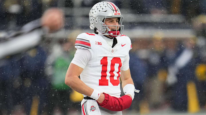 Ohio State Buckeyes quarterback Julian Sayin (10) smiles as he walks off the field following the NCAA football game against the Michigan Wolverines.