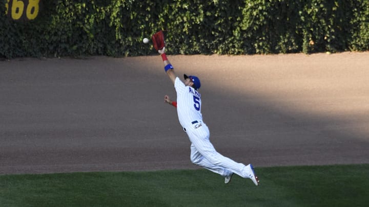 Aug 17, 2020; Chicago, Illinois, USA; Chicago Cubs center fielder Albert Almora Jr. (5) can't catch a triple hit by St. Louis Cardinals third baseman Brad Miller (not pictured) during the seventh inning at Wrigley Field.