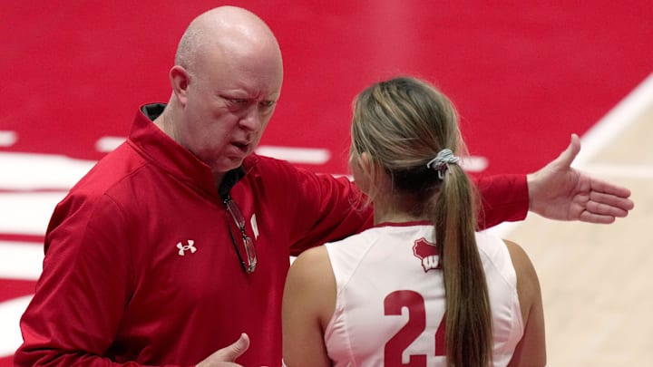 Wisconsin head coach Kelly Sheffield speaks with Charlie Fuerbringer (24) during their volleyball match Tuesday, September 9, 2025 at the Wisconsin Field House in Madison, Wisconsin. Wisconsin beat UW-Milwaukee 3-0.