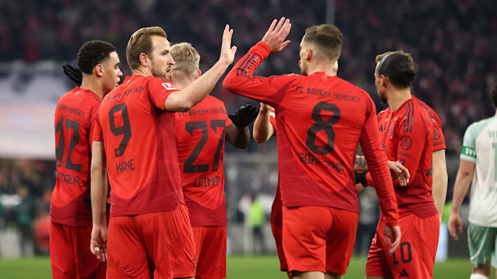 Bayern Munich players celebrating after a goal against Werder Bremen.