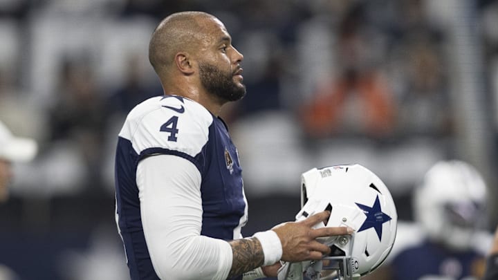 Dallas Cowboys quarterback Dak Prescott walks on the field before the game against the Washington Commanders Dallas Cowboys quarterback Dak Prescott walks on the field before the game against the Washington Commanders