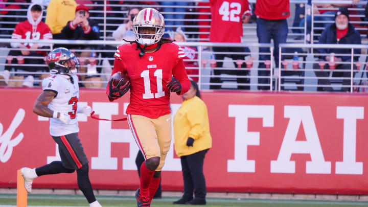 Nov 19, 2023; Santa Clara, California, USA; San Francisco 49ers wide receiver Brandon Aiyuk (11) runs after a catch for a 76-yard touchdown against the Tampa Bay Buccaneers during the third quarter at Levi's Stadium. Mandatory Credit: Kelley L Cox-USA TODAY Sports