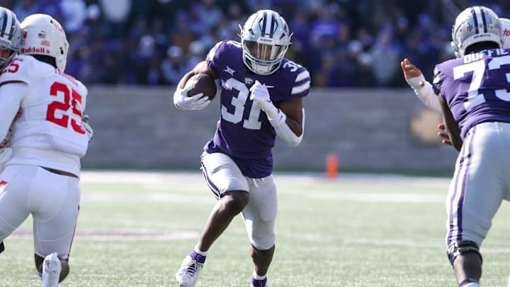 Oct 28, 2023; Manhattan, Kansas, USA; Kansas State Wildcats running back DJ Giddens (31) runs the ball up the middle against the Houston defense.