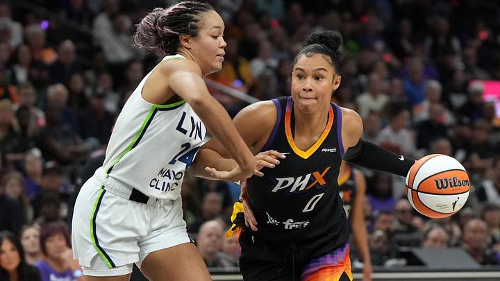 Sep 26, 2025; Phoenix, Arizona, USA; Phoenix Mercury forward Satou Sabally (0) shields the ball from Minnesota Lynx forward Napheesa Collier (24) during game three of the second round for the 2025 WNBA Playoffs at PHX Arena. Mandatory Credit: Rick Scuteri-Imagn Images