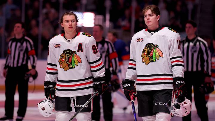 Mar 24, 2026; Elmont, New York, USA; Chicago Blackhawks centers Connor Bedard (98) and Anton Frondell (15) stand for the US national anthem before a game against the New York Islanders at UBS Arena. Mandatory Credit: Brad Penner-Imagn Images