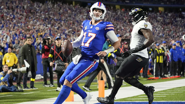 Buffalo Bills quarterback Josh Allen runs for a touchdown during the fourth quarter against the Baltimore Ravens. Buffalo Bills quarterback Josh Allen runs for a touchdown during the fourth quarter against the Baltimore Ravens.