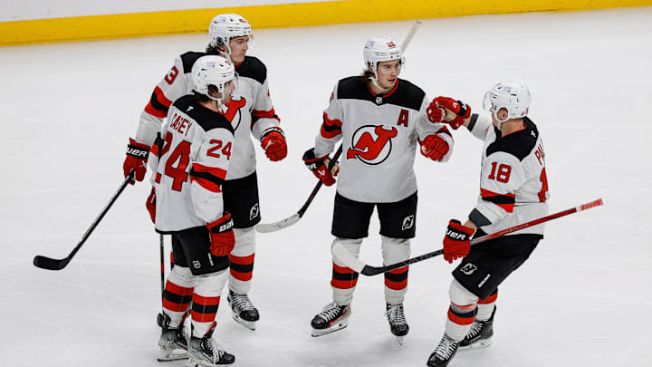 Feb 26, 2025; Denver, Colorado, USA; New Jersey Devils center Jack Hughes (86) celebrates his goal with defenseman Luke Hughes (43) and defenseman Seamus Casey (24) and left wing Ondrej Palat (18) in the third period against the Colorado Avalanche at Ball Arena. Mandatory Credit: Isaiah J. Downing-Imagn Images