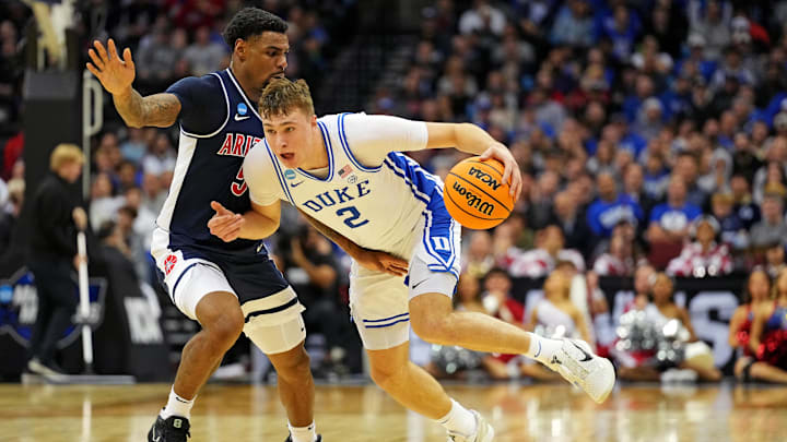 Mar 27, 2025; Newark, NJ, USA; Duke Blue Devils forward Cooper Flagg (2) drives to the basket against Arizona Wildcats guard KJ Lewis (5) during the second half during an East Regional semifinal of the 2025 NCAA tournament at Prudential Center. Mandatory Credit: Robert Deutsch-Imagn Images