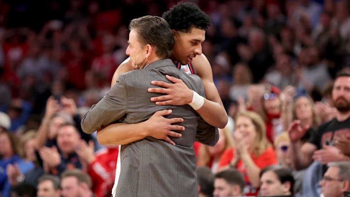 Pitino hugs RJ Luis. Pitino hugs RJ Luis.