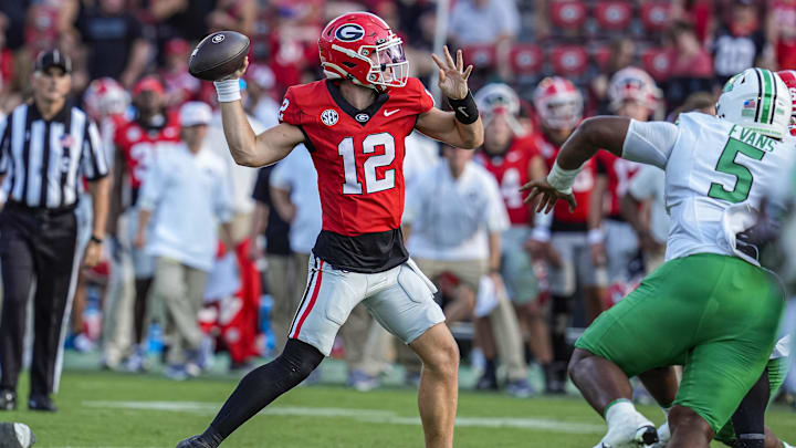 Aug 30, 2025; Athens, Georgia, USA; Georgia Bulldogs quarterback Ryan Puglisi (12) passes  against the Marshall Thundering Herd at Sanford Stadium. Mandatory Credit: Dale Zanine-Imagn Images
