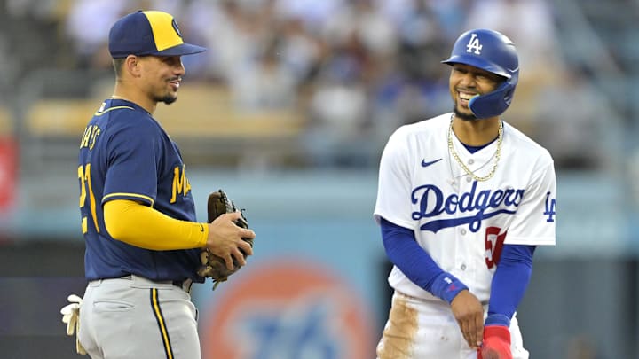 Aug 17, 2023; Los Angeles, California, USA;  Milwaukee Brewers shortstop Willy Adames (27) speaks with Los Angeles Dodgers right fielder Mookie Betts (50) at second base in the first inning at Dodger Stadium. Mandatory Credit: Jayne Kamin-Oncea-USA TODAY Sports