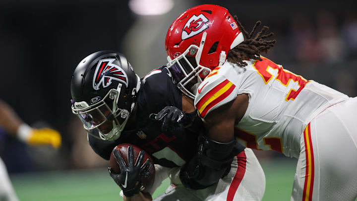 Sep 22, 2024; Atlanta, Georgia, USA; Atlanta Falcons wide receiver Darnell Mooney (1) is tackled by Kansas City Chiefs linebacker Nick Bolton (32) in the first quarter at Mercedes-Benz Stadium. Mandatory Credit: Brett Davis-Imagn Images
