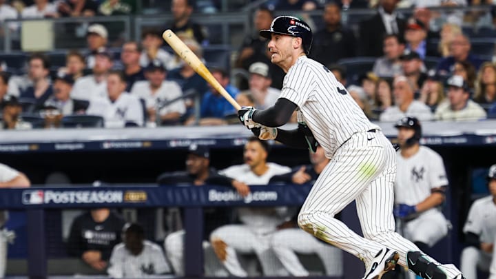 Oct 7, 2025; Bronx, New York, USA; New York Yankees outfielder Cody Bellinger (35) hits a single in the third inning against the Toronto Blue Jays during game three of the ALDS round for the 2025 MLB playoffs at Yankee Stadium. Mandatory Credit: Vincent Carchietta-Imagn Images