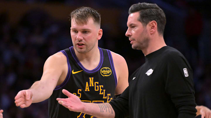 Los Angeles Lakers guard Luka Doncic talks with head coach JJ Redick. Los Angeles Lakers guard Luka Doncic talks with head coach JJ Redick.