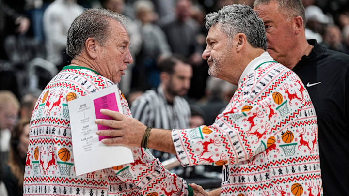 Michigan State head coach Tom Izzo, left, shakes hands with Oakland head coach Greg Kampe after 79-70 win at Little Caesars Arena in Detroit on Saturday, Dec. 20, 2025.