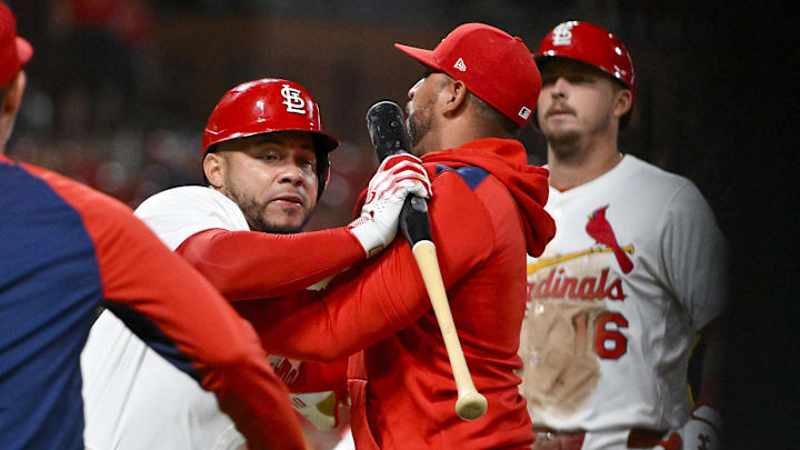 Aug 25, 2025; St. Louis, Missouri, USA;  St. Louis Cardinals designated hitter Willson Contreras (40) is held back by manager Oliver Marmol (37) after he was ejected by umpire Derek Thomas (not pictured) during the seventh inning against the Pittsburgh Pirates at Busch Stadium. Mandatory Credit: Jeff Curry-Imagn Images