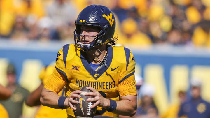 Aug 30, 2025; Morgantown, West Virginia, USA; West Virginia Mountaineers quarterback Nicco Marchiol (8) rolls out to pass during the third quarter against the Robert Morris Colonials at Milan Puskar Stadium. Mandatory Credit: Ben Queen-Imagn Images