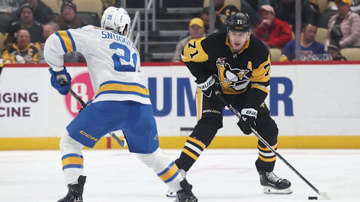 Oct 27, 2025; Pittsburgh, Pennsylvania, USA; Pittsburgh Penguins center Evgeni Malkin (71) skates with the puck against St. Louis Blues right wing Jimmy Snuggerud (21) during the third period at PPG Paints Arena. Mandatory Credit: Charles LeClaire-Imagn Images Oct 27, 2025; Pittsburgh, Pennsylvania, USA; Pittsburgh Penguins center Evgeni Malkin (71) skates with the puck against St. Louis Blues right wing Jimmy Snuggerud (21) during the third period at PPG Paints Arena. Mandatory Credit: Charles LeClaire-Imagn Images