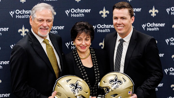Feb 13, 2025; New Orleans, LA, USA;  New Orleans Saints owner Gayle Benson and general manager Mickey Loomis pose with the new head coach Kellen Moore at Ochsner Sports Performance Center. Mandatory Credit: Stephen Lew-Imagn Images