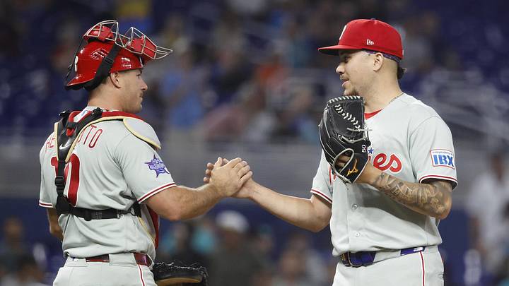 Philadelphia Phillies catcher J.T. Realmuto (10) and relief pitcher Orion Kerkering celebrating