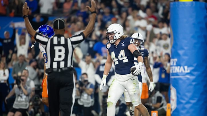 Dec 31, 2024; Glendale, AZ, USA; Penn State Nittany Lions tight end Tyler Warren (44) celebrates after scoring a touchdown against the Boise State Broncos in the Fiesta Bowl at State Farm Stadium. Mandatory Credit: Mark J. Rebilas-Imagn Images