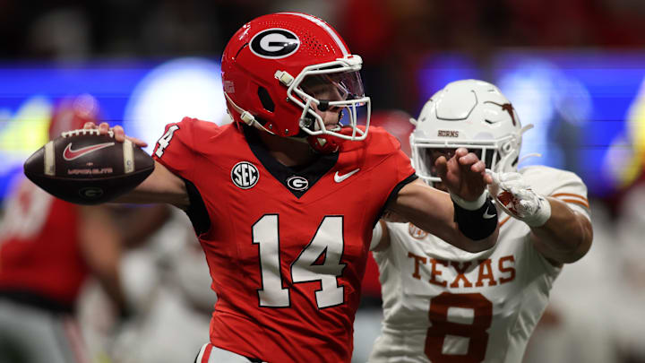 Georgia Bulldogs quarterback Gunner Stockton drops back to pass against the Texas Longhorns during the second half in the 2024 SEC Championship game at Mercedes-Benz Stadium.
