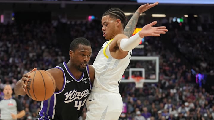 Mar 31, 2024; Sacramento, California, USA; Sacramento Kings forward Harrison Barnes (left) dribbles