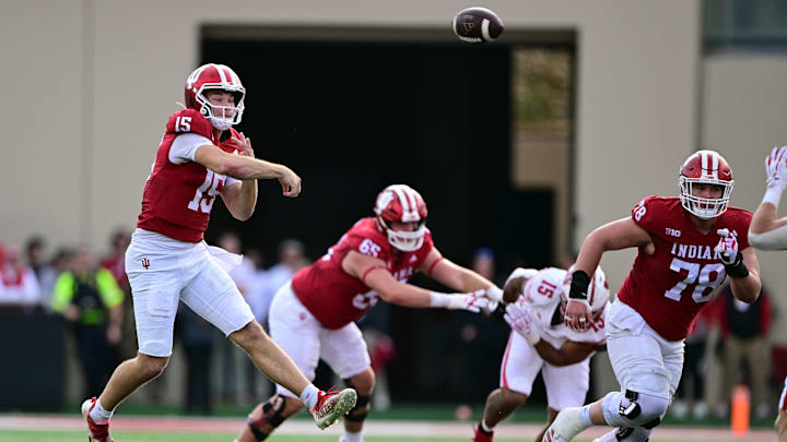 Nov 15, 2025; Bloomington, Indiana, USA; Indiana Hoosiers quarterback Fernando Mendoza (15) throws a pass during the second half against the Wisconsin Badgers at Memorial Stadium. Mandatory Credit: Marc Lebryk-Imagn Images