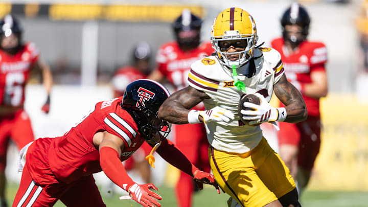 Oct 18, 2025; Tempe, Arizona, USA; Arizona State Sun Devils wide receiver Jaren Hamilton (16) runs the ball against diving Texas Tech Red Raiders safety Brenden Jordan in the first half at Mountain America Stadium. Mandatory Credit: Mark J. Rebilas-Imagn Images