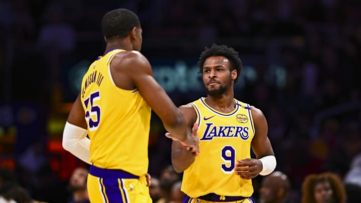 Apr 11, 2025; Los Angeles, California, USA; Los Angeles Lakers guard Bronny James Jr. (9) celebrates with center Trey Jemison III (55) after scoring against the Houston Rockets during the second half at Crypto.com Arena. Mandatory Credit: Jonathan Hui-Imagn Images