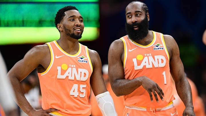 Mar 24, 2026; Cleveland, Ohio, USA; Cleveland Cavaliers guard Donovan Mitchell (45) and guard James Harden (1) talk during a free throw attempt during the second half against the Orlando Magic at Rocket Arena. Mandatory Credit: David Dermer-Imagn Images