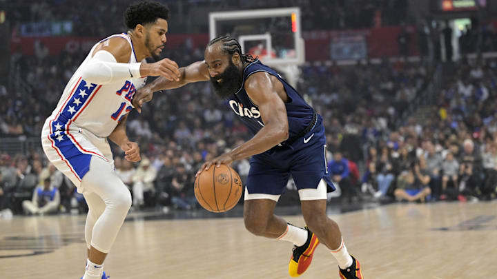 Mar 24, 2024; Los Angeles, California, USA;  Los Angeles Clippers guard James Harden (1) is defended by Philadelphia 76ers guard Buddy Hield (17) as he drives to the basket in the first half at Crypto.com Arena. Mandatory Credit: Jayne Kamin-Oncea-Imagn Images