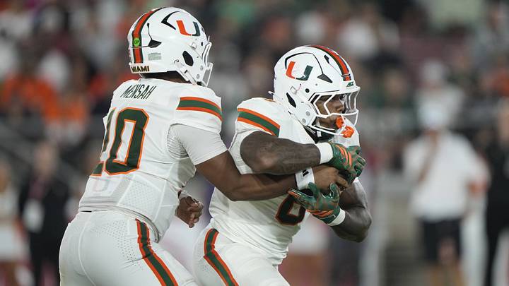 Sep 4, 2026; Stanford, California, USA; Miami Hurricanes quarterback Darian Mensah (10) hands off to running back CharMar Brown (6) against the Stanford Cardinal during the third quarter at Stanford Stadium. Mandatory Credit: Stan Szeto-Imagn Images Sep 4, 2026; Stanford, California, USA; Miami Hurricanes quarterback Darian Mensah (10) hands off to running back CharMar Brown (6) against the Stanford Cardinal during the third quarter at Stanford Stadium. Mandatory Credit: Stan Szeto-Imagn Images