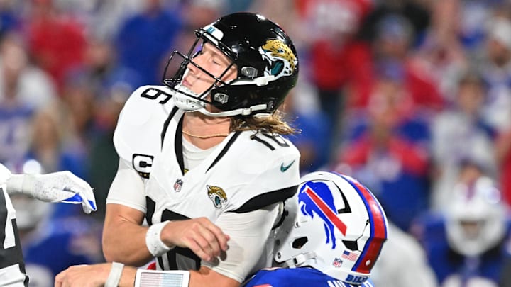 Sep 23, 2024; Orchard Park, New York, USA; Jacksonville Jaguars quarterback Trevor Lawrence (16) is hit by Buffalo Bills linebacker Von Miller (40) in the fourth quarter at Highmark Stadium. Mandatory Credit: Mark Konezny-Imagn Images